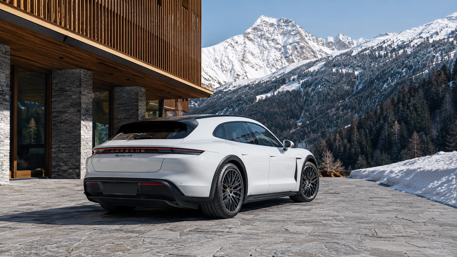 АВТО 1001215 белый Porsche Taycan Cross Turismo у горного отеля