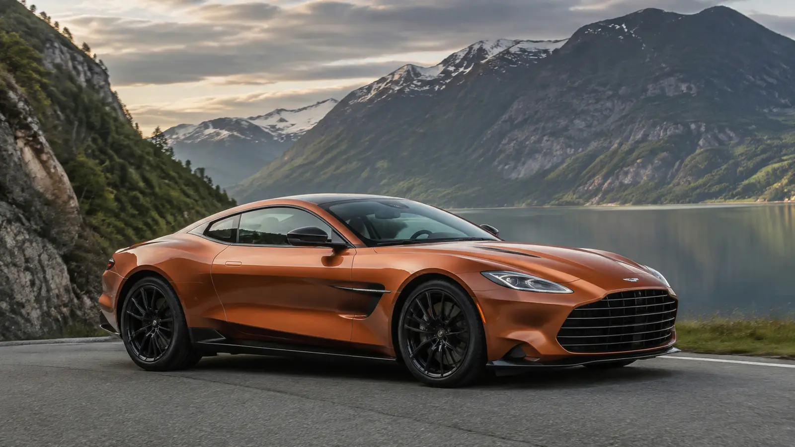 АВТО 1002564 медный Aston Martin Vanquish на дороге у фьорда