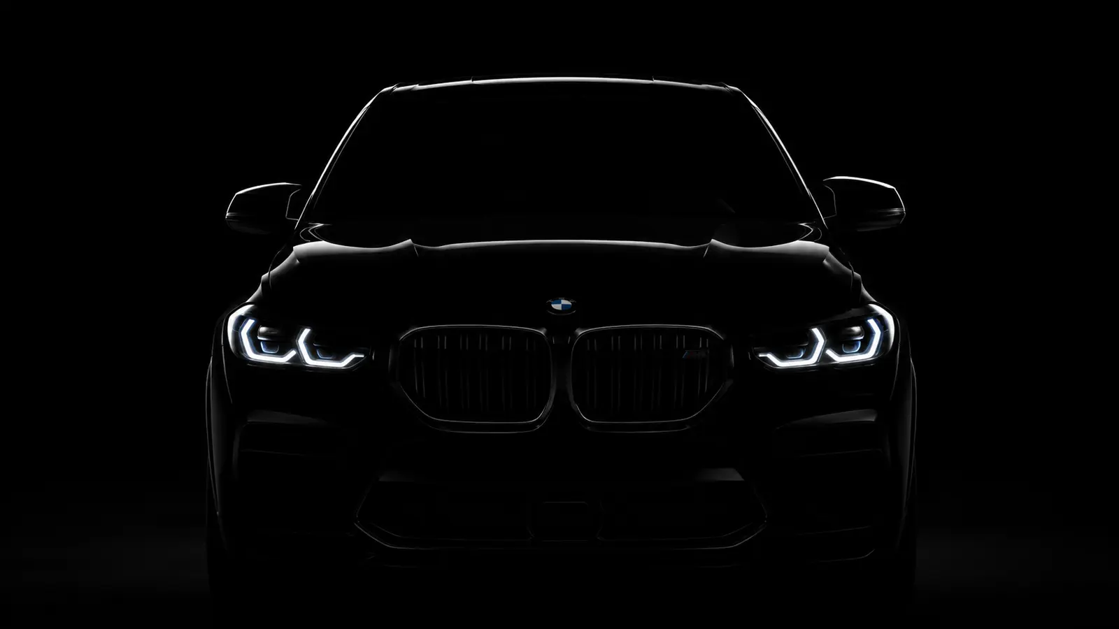 АВТО 1000883 чёрный BMW X6 в темноте с горящими фарами